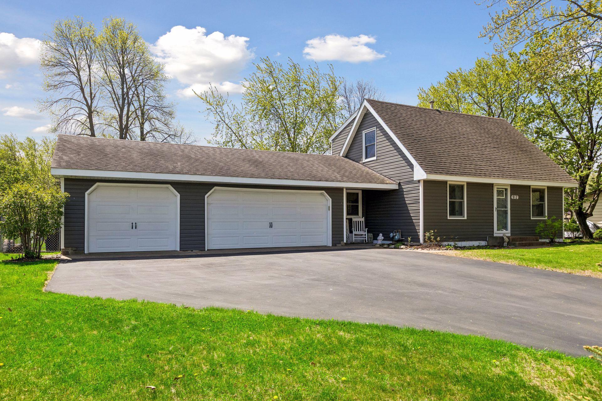 3 car garage with spacious asphalt driveway