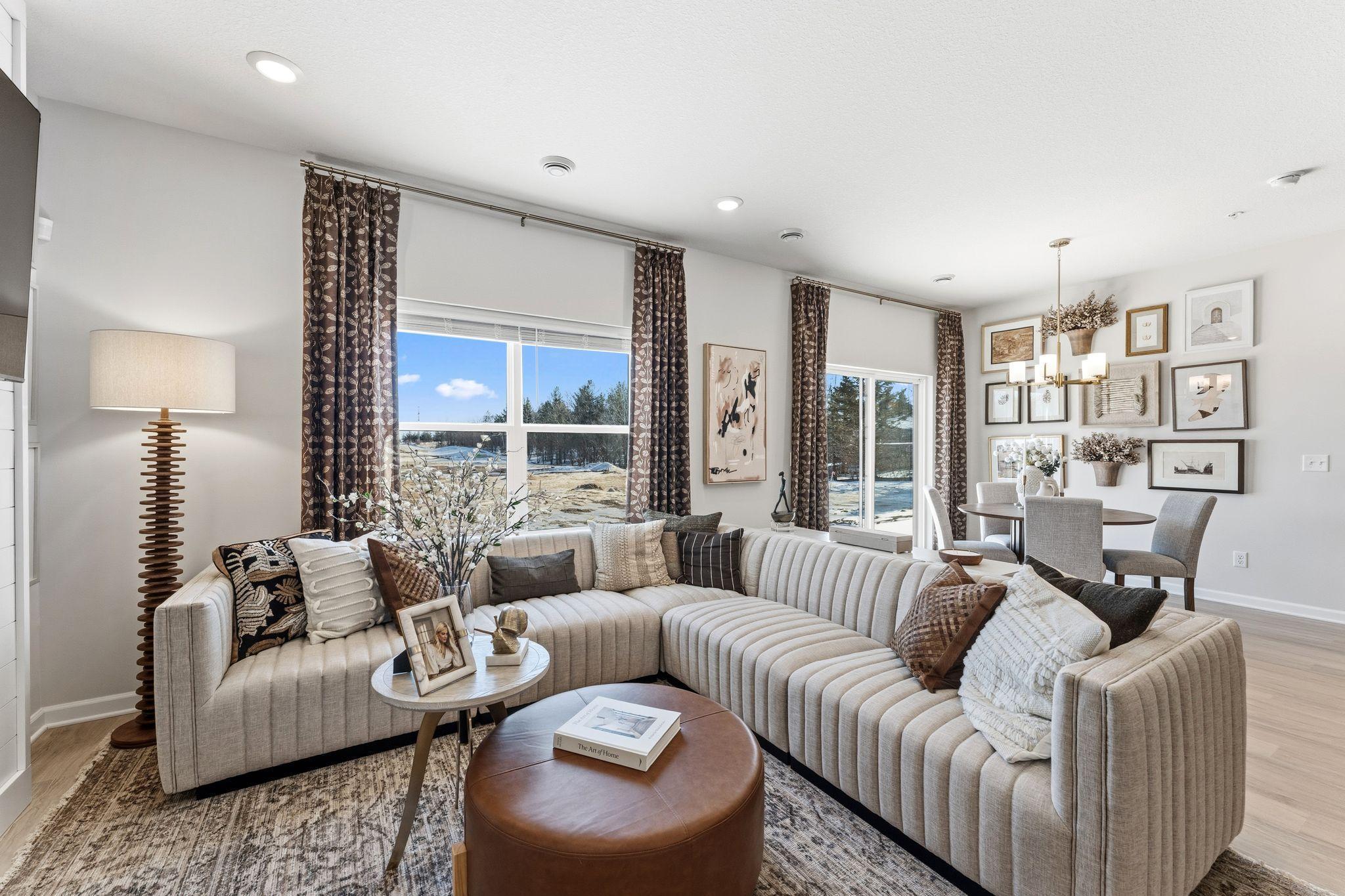 Family room features electric fireplace and blinds - for illustrative purposes only