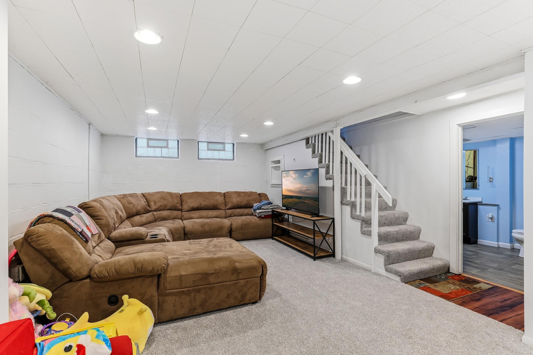 Family room in the lower level is big enough for this huge couch!