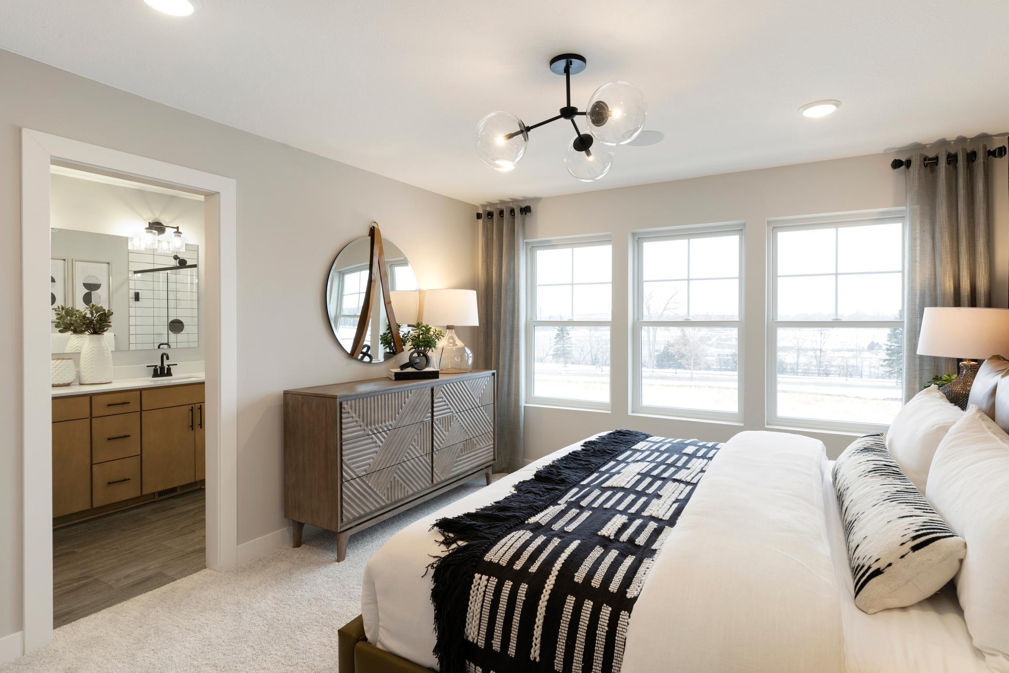 Owners Bedroom and Bath. Photo is of a similar model home.
