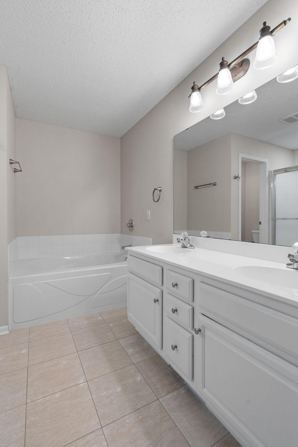 Upper level bathroom with separate tub