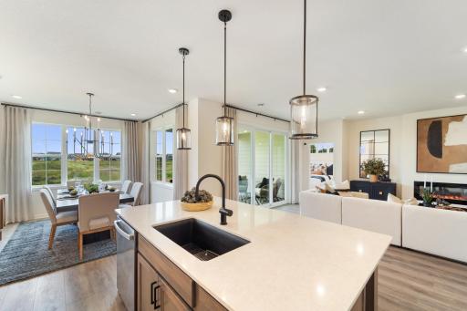 The kitchen is central to the dining and living areas