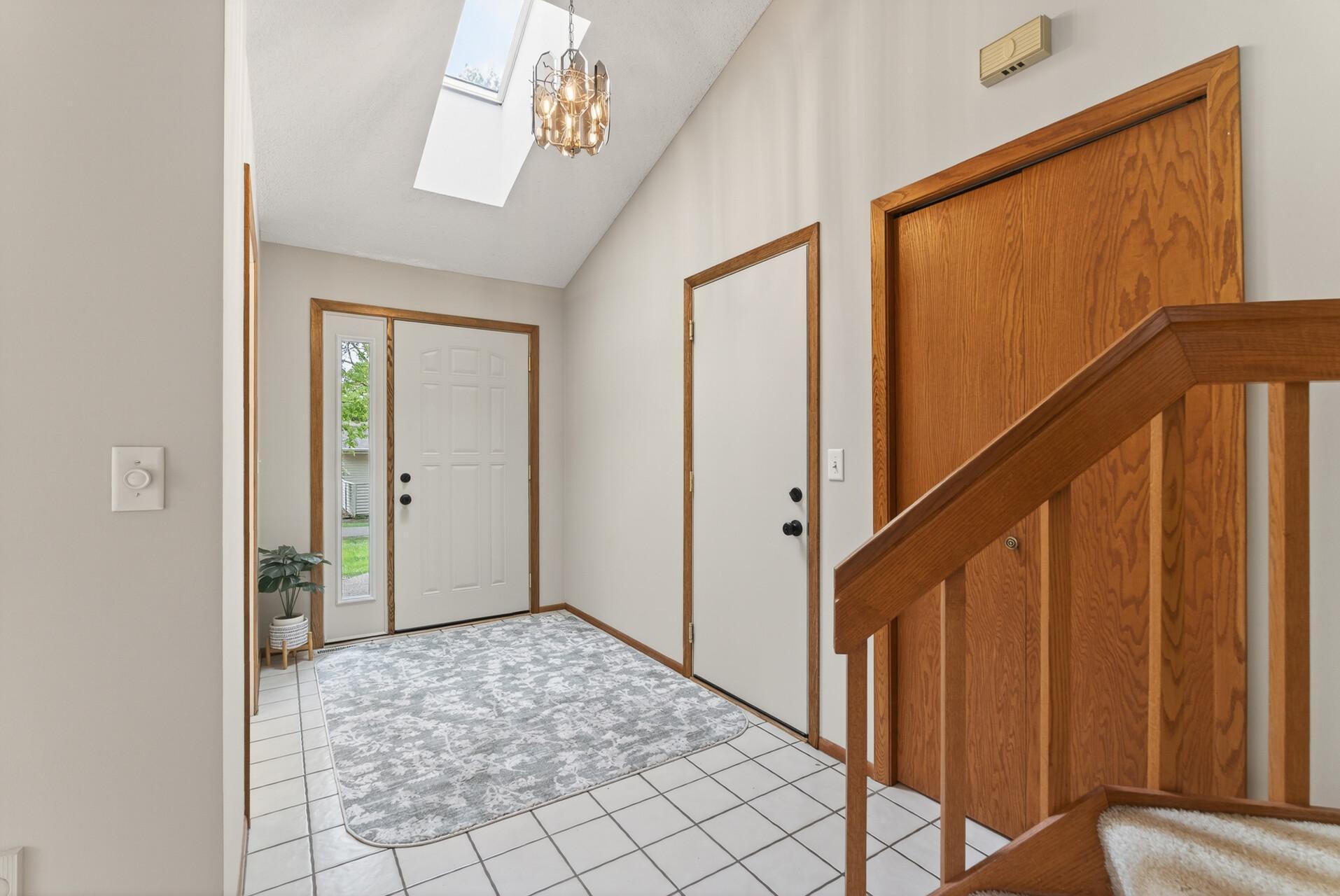 Large foyer has a skylight and large closet