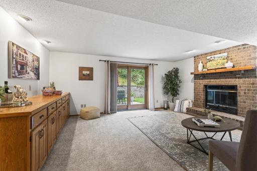 Lower level family room walkout leads to the private patio