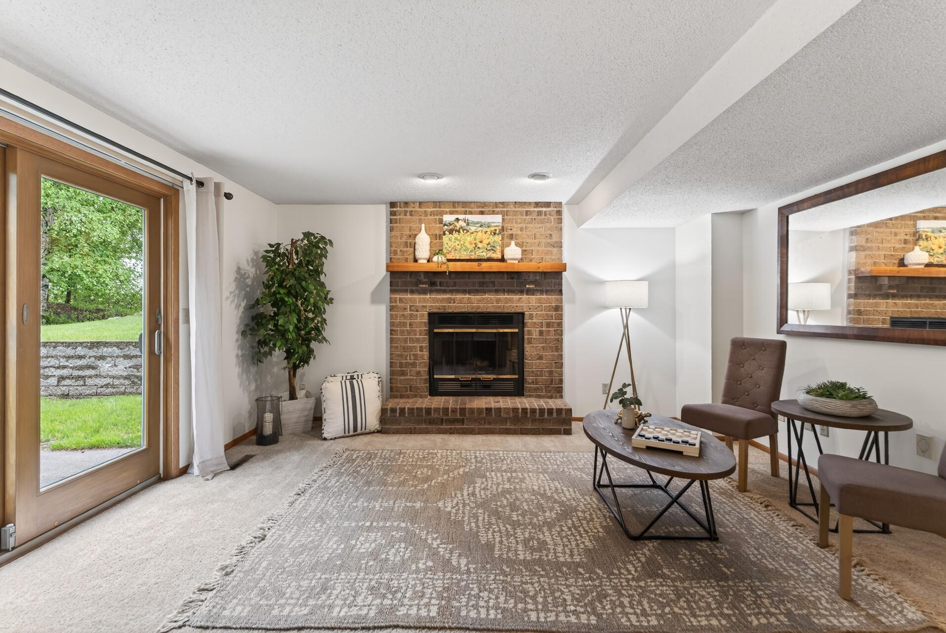 Family room features a wood burning fireplace