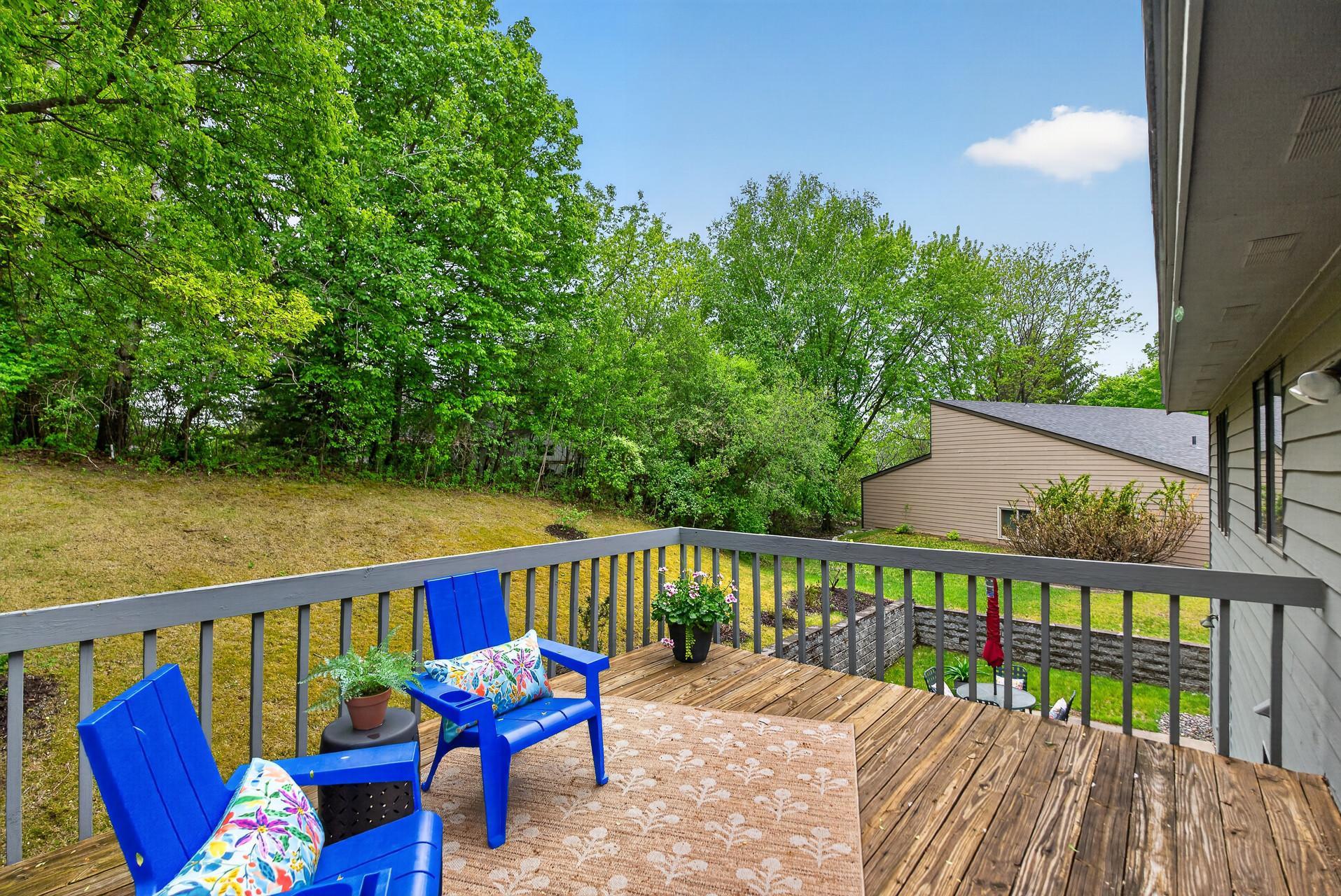 The deck overlooks the private patio area below