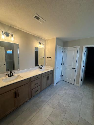 Primary Bath Two Sinks and Linen closet.jpg