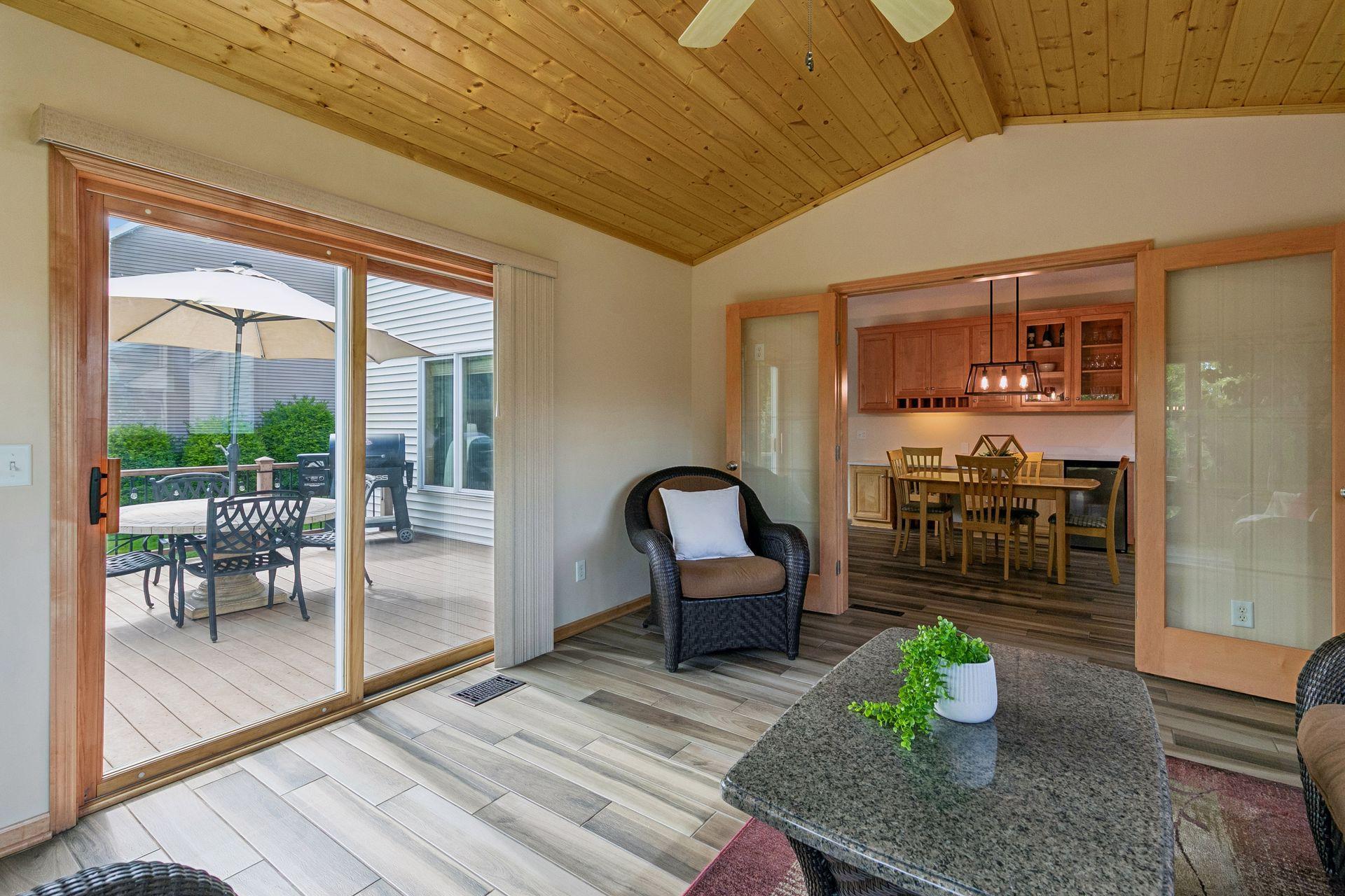 Sunroom leading to Trex outdoor deck