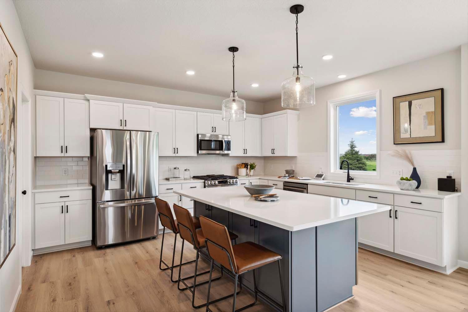 Spacious kitchen with abundant cabinet space. Photos and/or illustrations are of like home and may not depict actual home plan configurations. Features, materials and finishes may contain options that are not included in price.