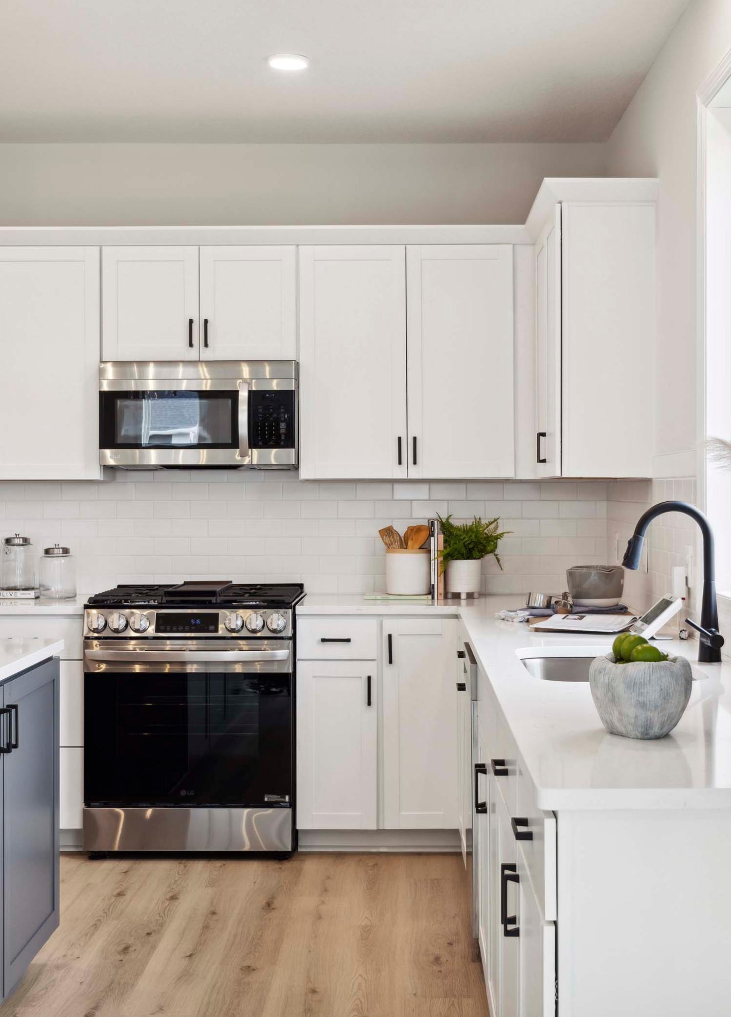 Sleek gas slide-in range. Photos and/or illustrations are of like home and may not depict actual home plan configurations. Features, materials and finishes may contain options that are not included in price.