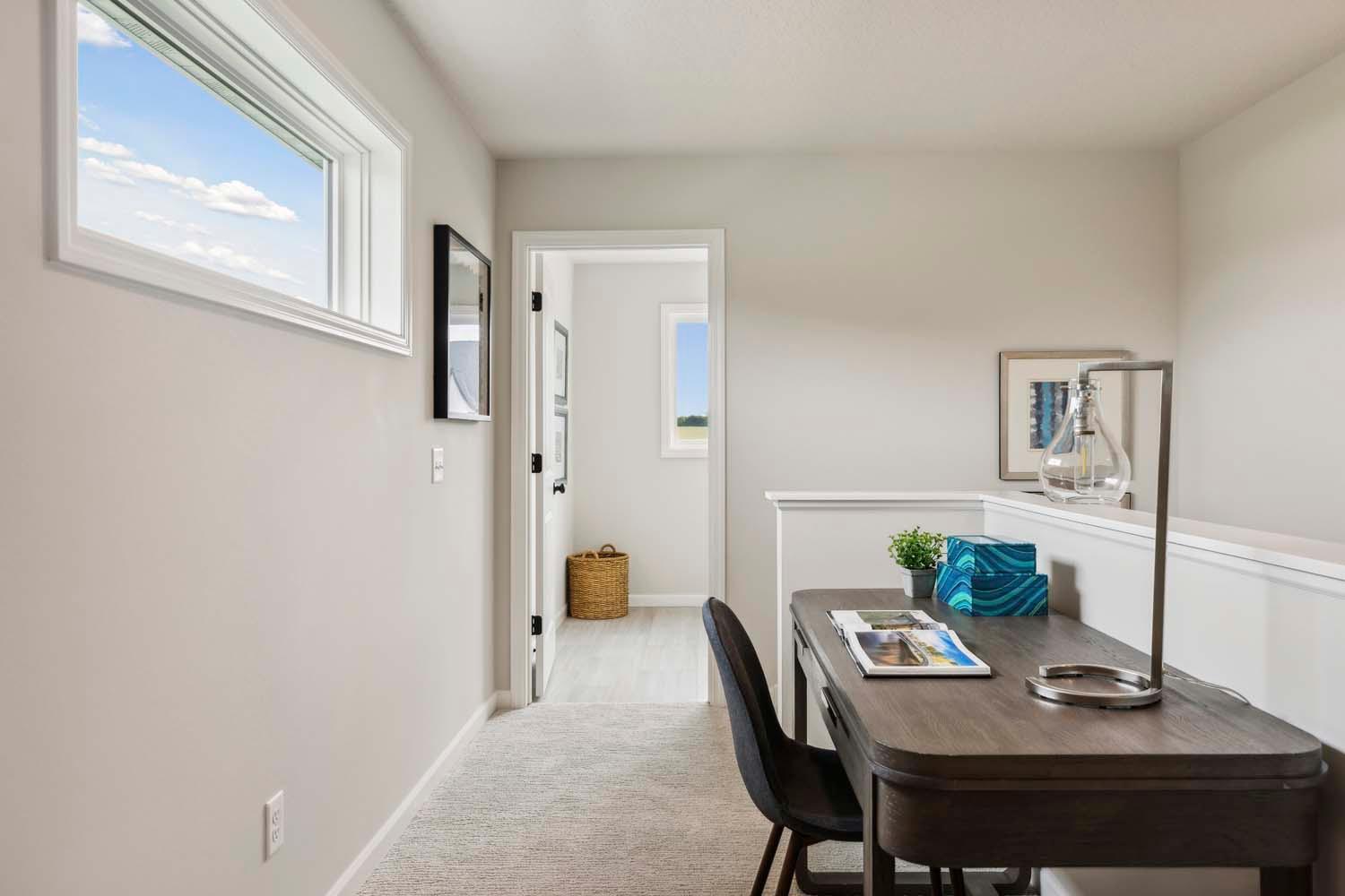 Second floor workspace includes lots of natural light. Photos and/or illustrations are of like home and may not depict actual home plan configurations. Features, materials and finishes may contain options that are not included in price.