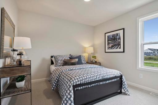 One of four bedrooms. Photos and/or illustrations are of like home and may not depict actual home plan configurations. Features, materials and finishes may contain options that are not included in price.