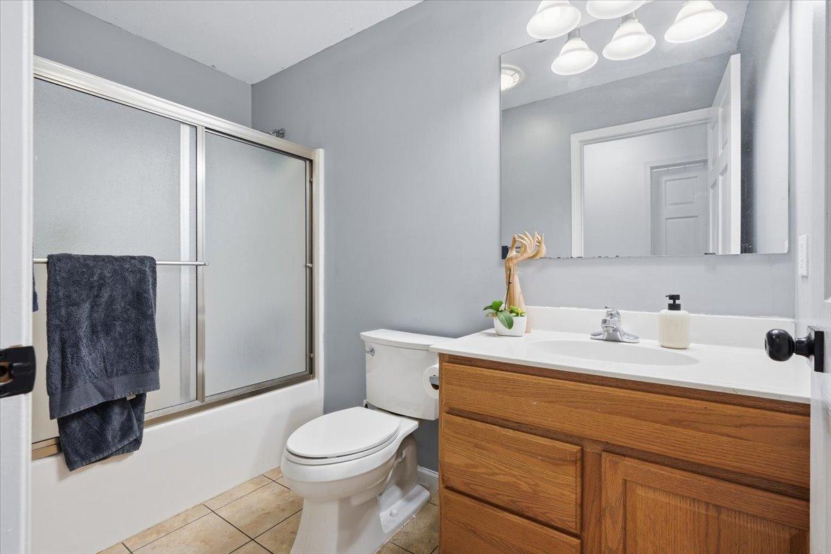 A convenient full bath is tucked in the hallway between the bedrooms on the upper level.