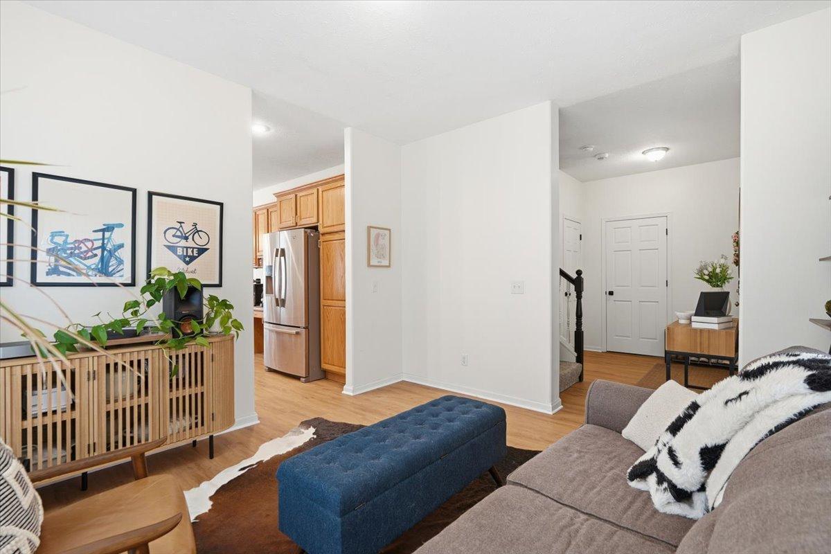 The front room is to the left of the front foyer, conveniently tucked between the kitchen and the staircase to head to the upper level.