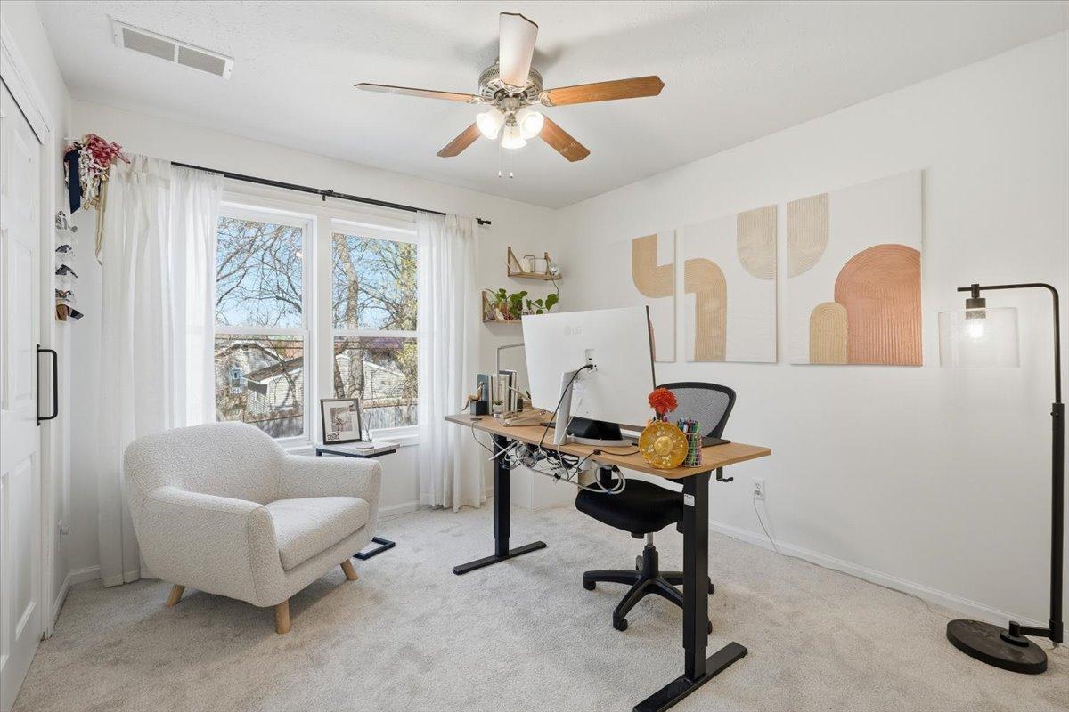 The third upper level also functions as an office, greeted with warm light!