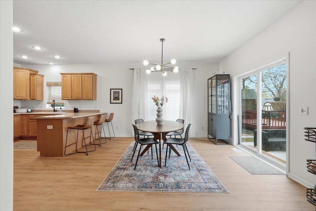 A large sliding glass door leads directly into the fully fenced in backyard