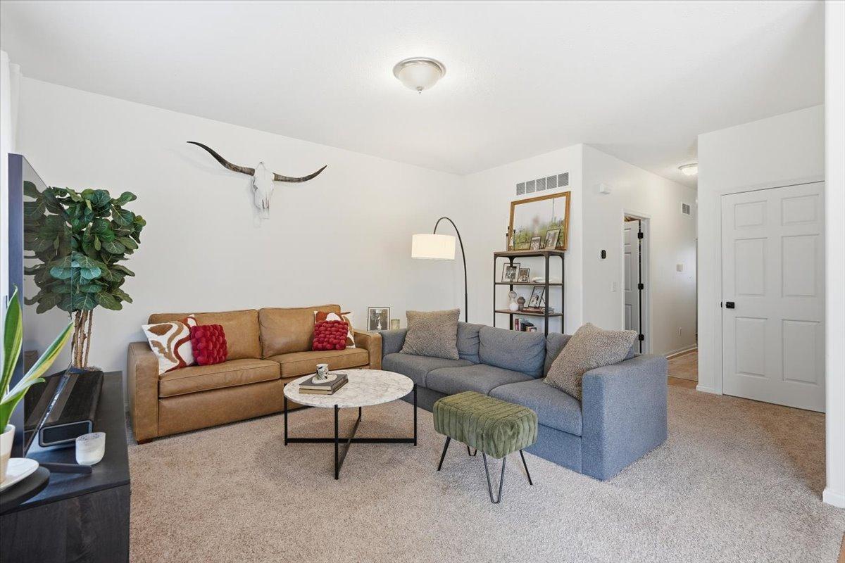 Newer carpeting seamlessly blends this space into the entertaining zones on the main level