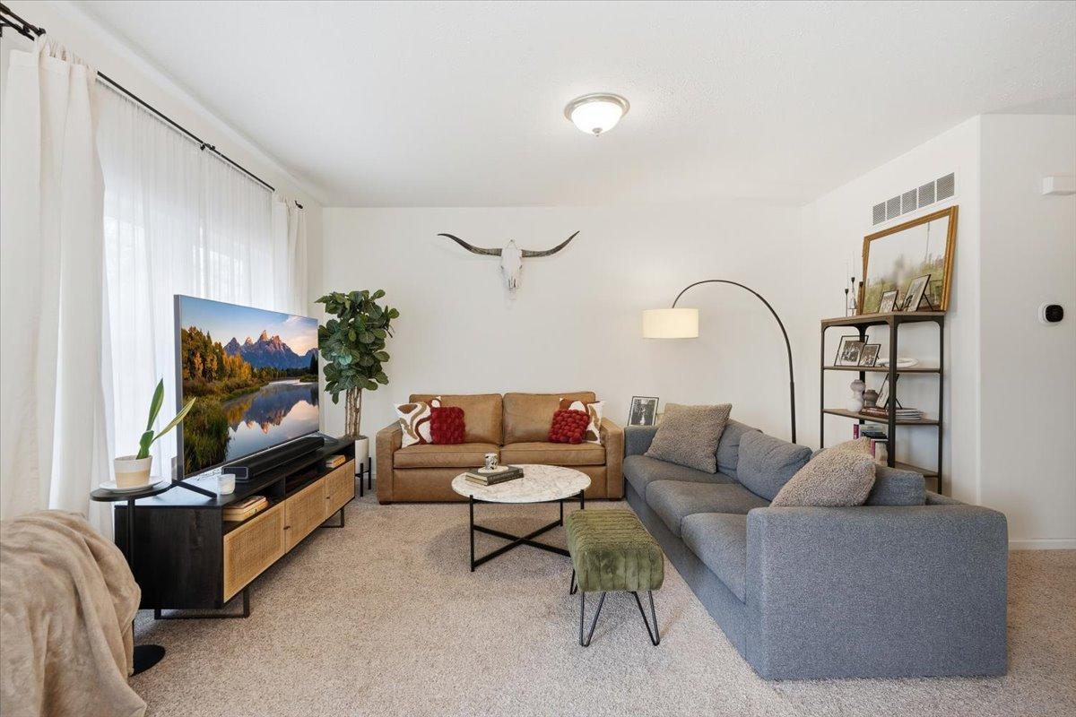 Whether you are snuggled in for movie night or hosting friends for brunch, this space is flexible to accommodate all your needs