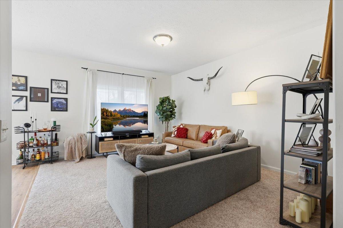 When you enter the home you are welcomed by a cozy family room, complete with ample space and wonderful natural light