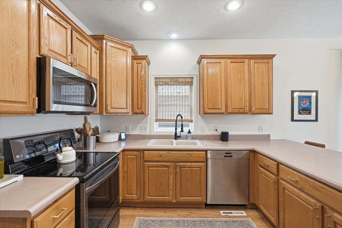 Natural light soaks into the kitchen, inviting and warming the space