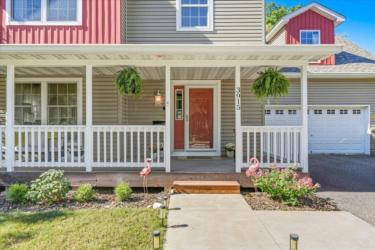 A covered front porch instantly greets you upon arrival
