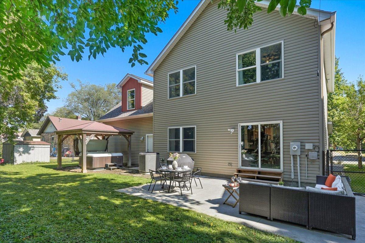 To the left you will see a built in pergola and hot tub that will remain with the home!
