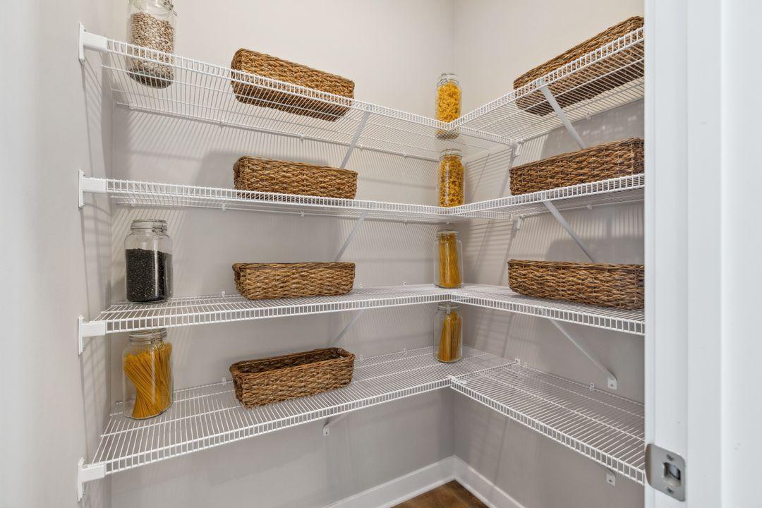 Large pantry for your kitchen gadgets and warehouse store shopping sprees! Model home, color and finish will vary.