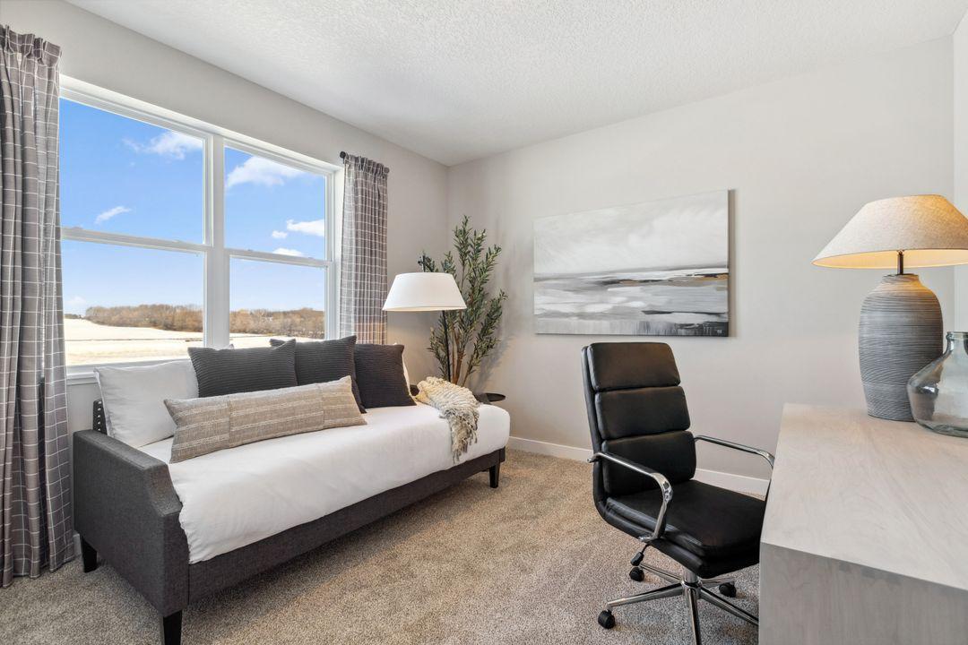 Tucked in the back corner away from the hustle and bustle of the main level living spaces, this bedroom resides adjacent to a 3/4 bath & serves as the perfect guest room or home office! Model home, color and finish will vary.
