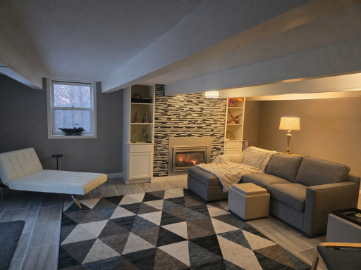 Finished basement with fireplace