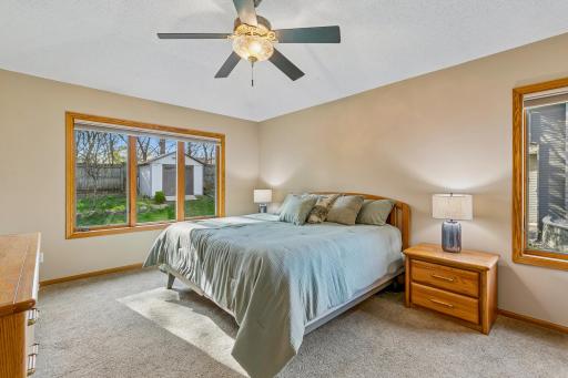 Primary Bedroom Suite overlooks backyard, freshly painted
