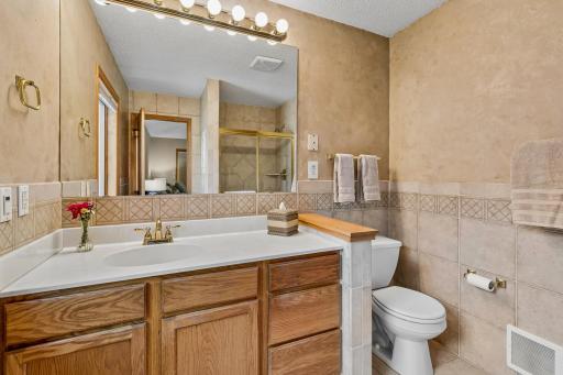 Primary Bathroom has custom tile and shower