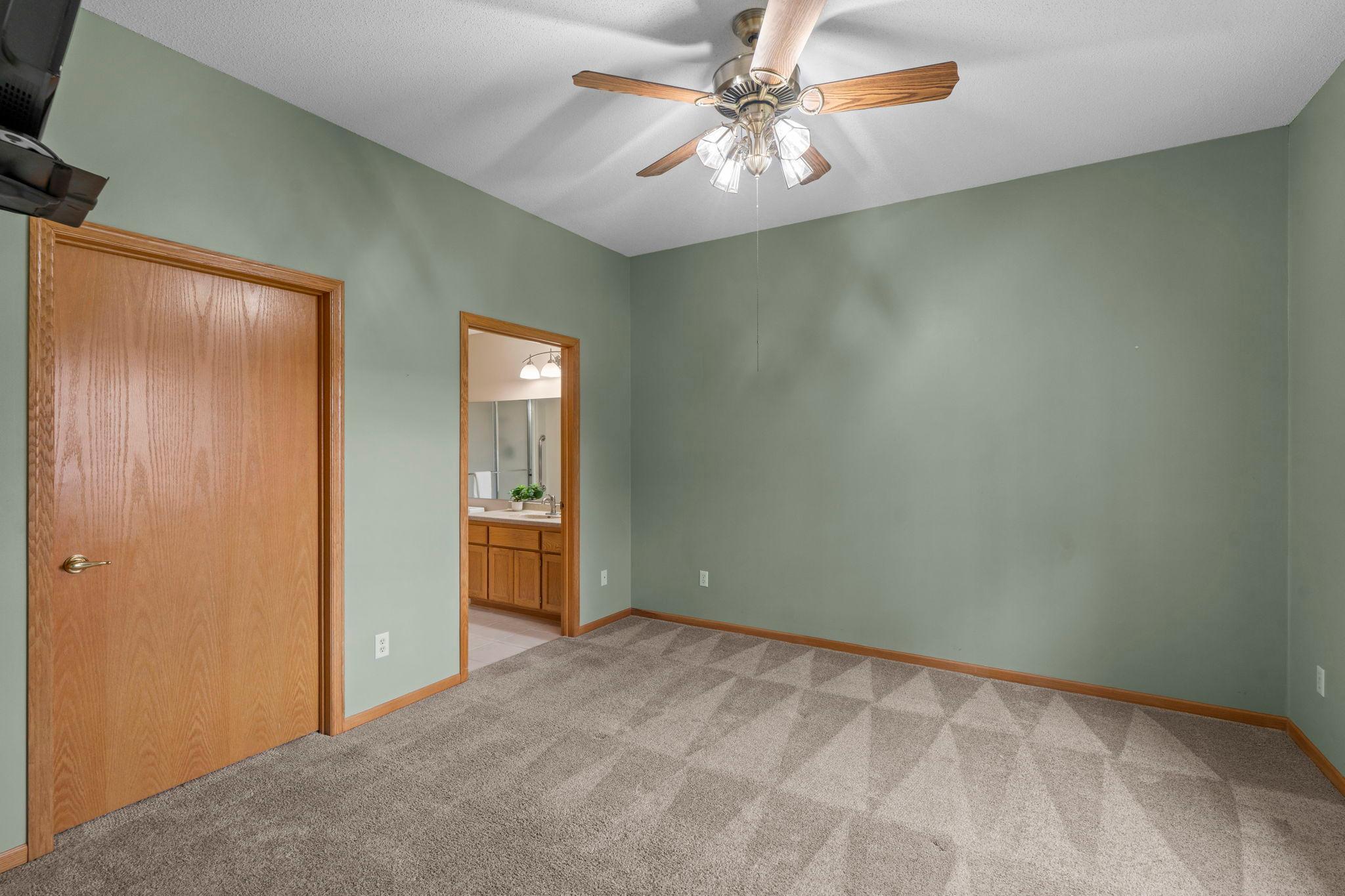 Spacious primary bedroom suite with a private bathroom and generous sized walk in closet.