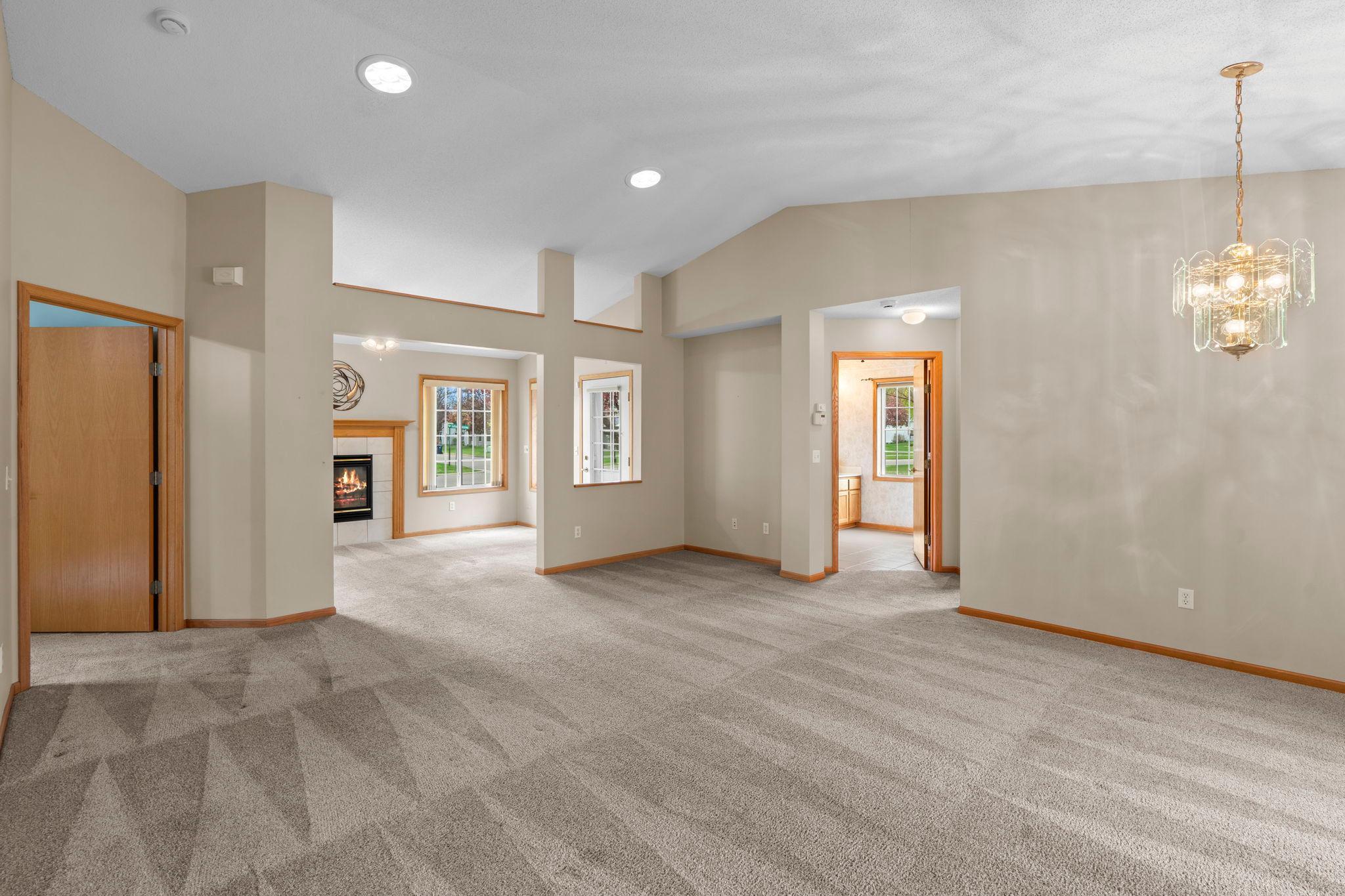 Soaring vaulted ceilings and distinctive architectural details create a stunning visual statement while enhancing the home’s open, airy feel.