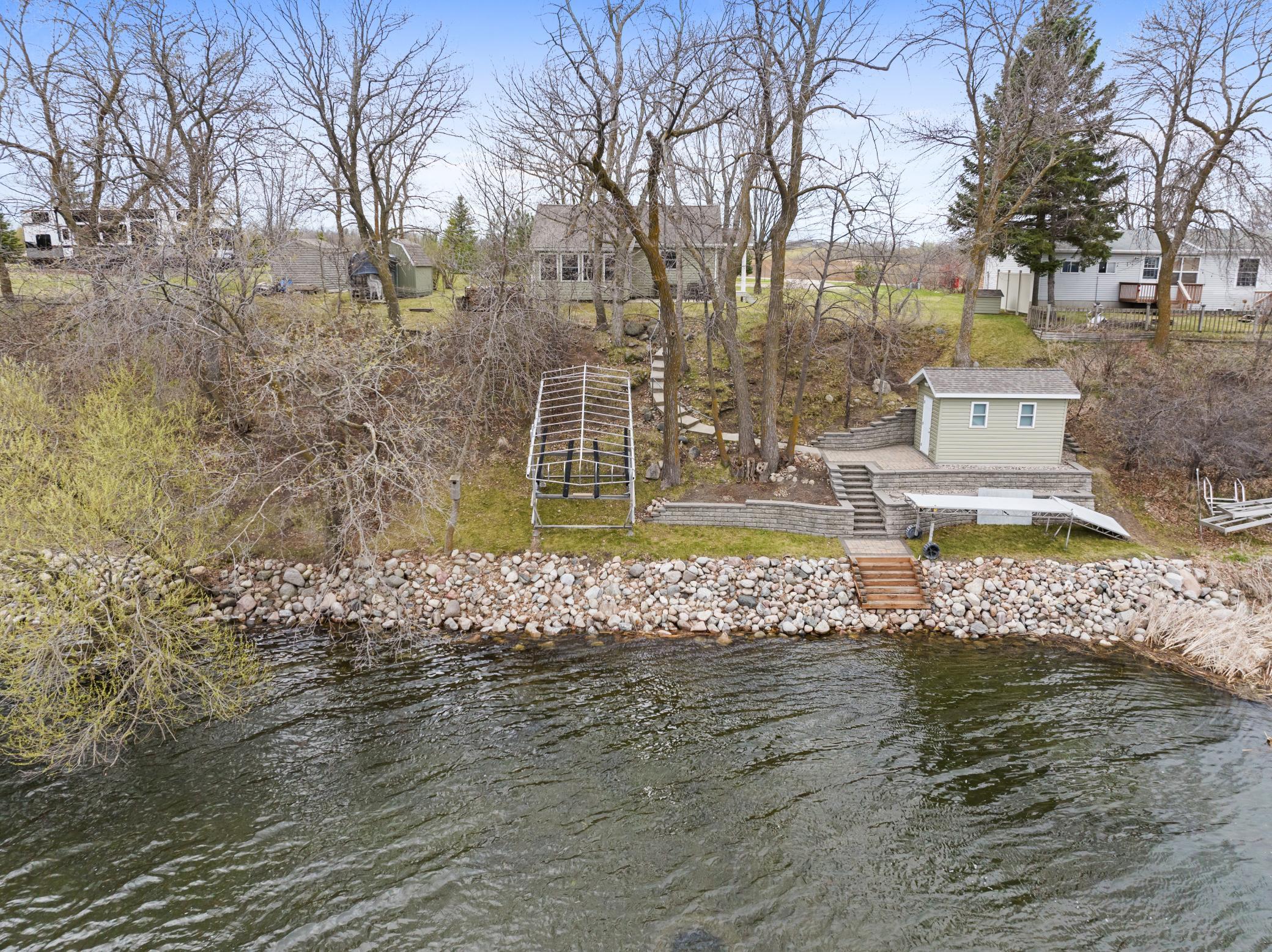 Shoreline is riprapped, new shed/bunk house at the lake
