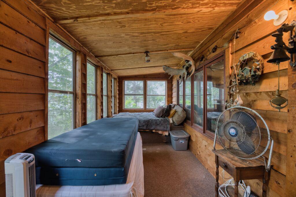 Enclosed porch with sleeping arrangements