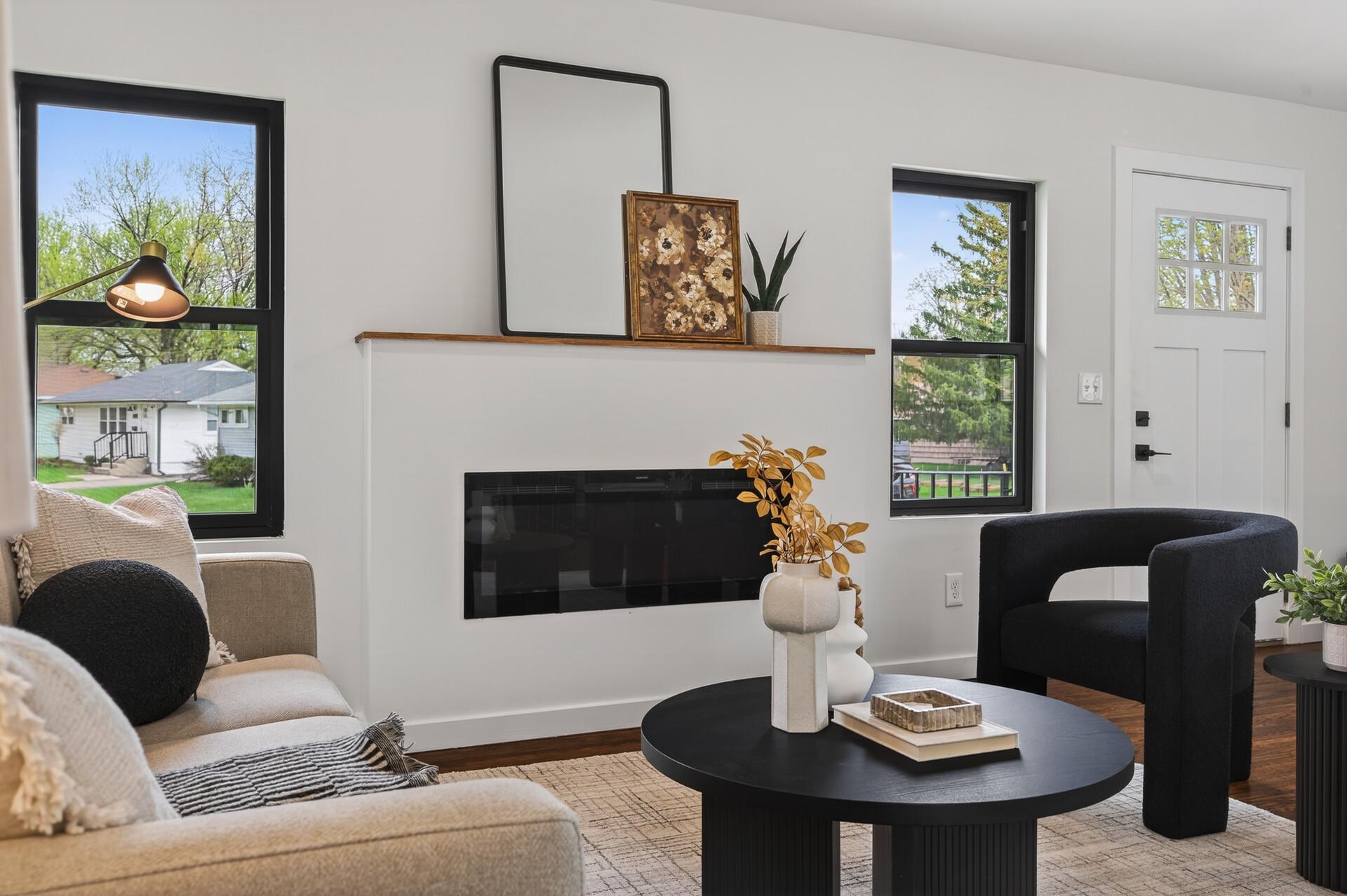 Living room with Anderson windows and electric fireplace