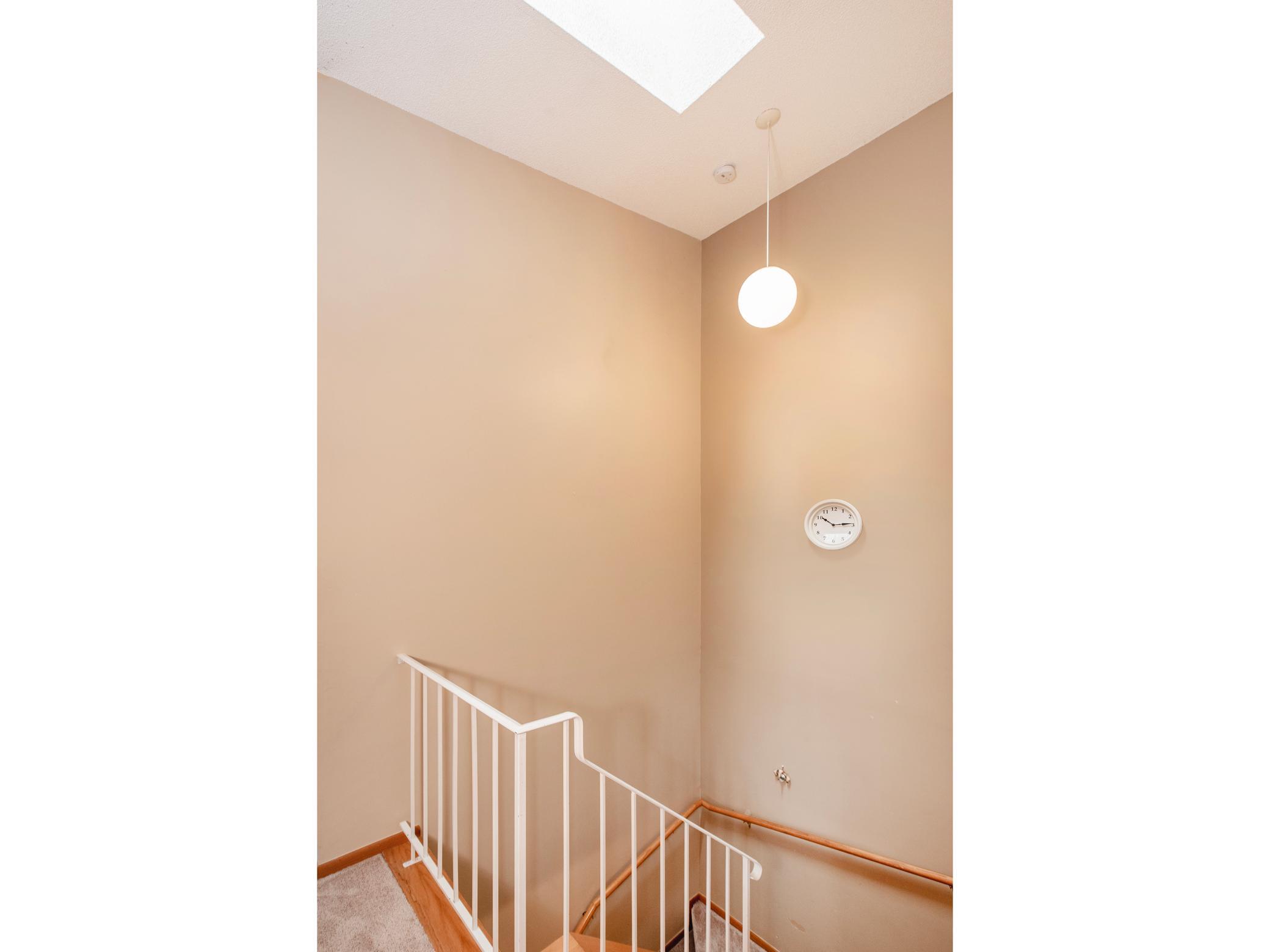 Skylight in vaulted stairway give nice, natural light.