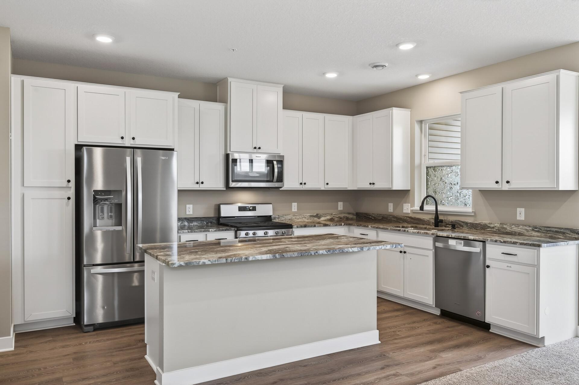 Granite countertops and a large island.jpg