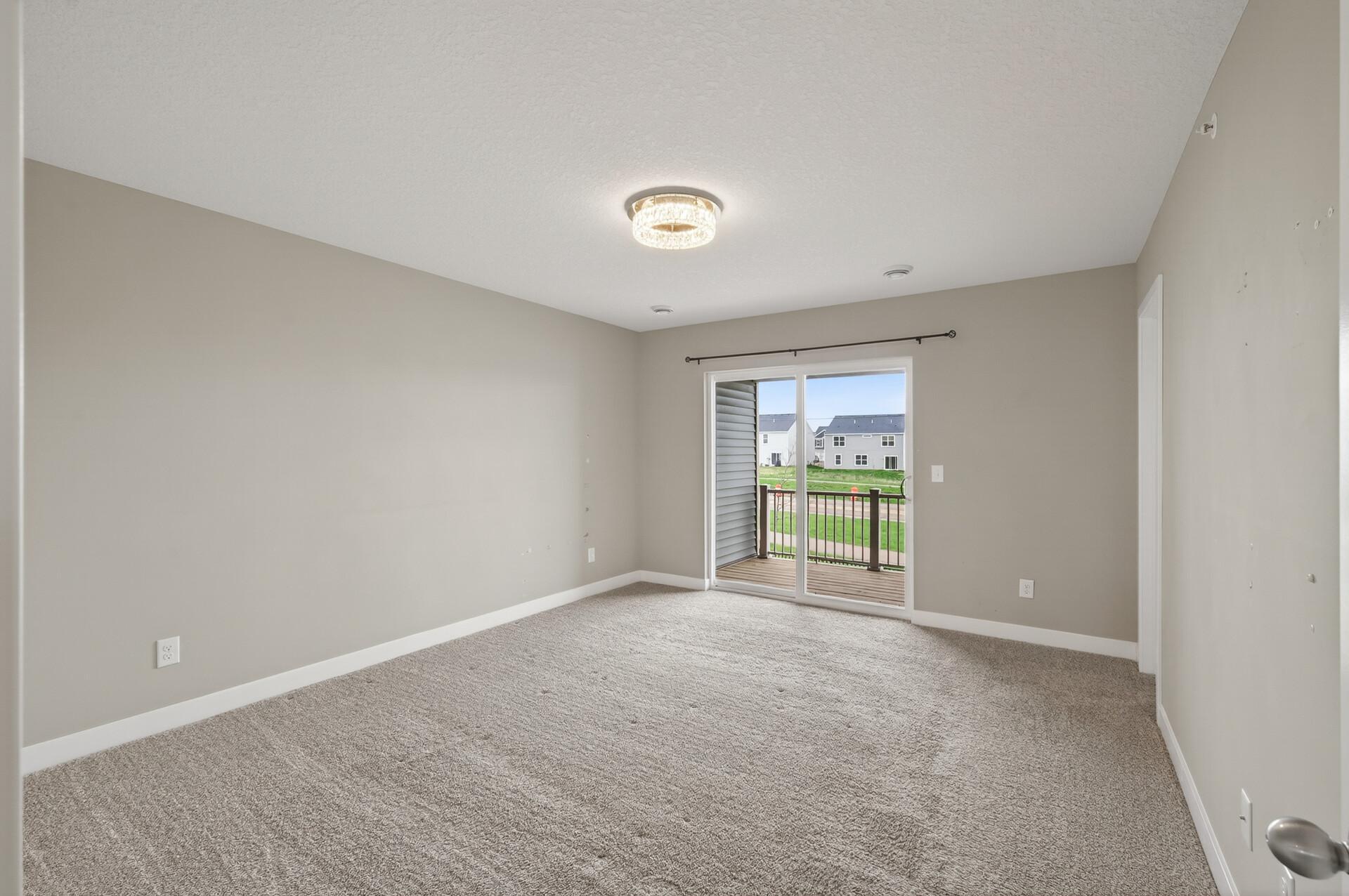 Primary bedroom with personal covered patio.jpg