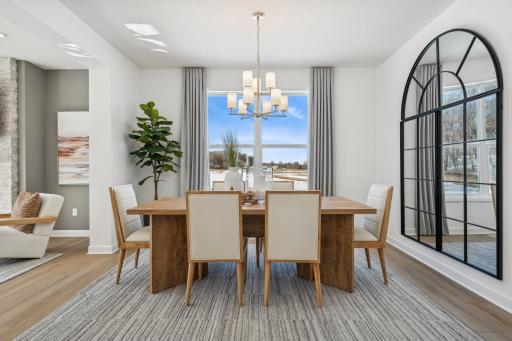 This formal dining area is large enough to comfortably accommodate a 10-seat dining room table. (Photo is of the actual home.)