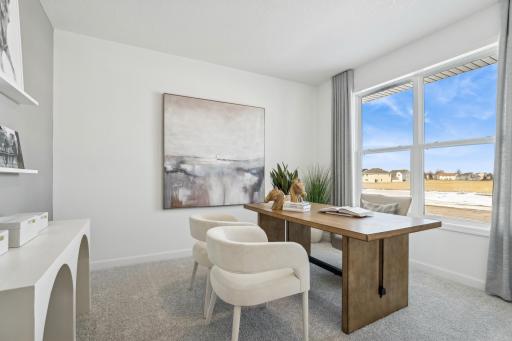 This main level study provides a perfect setting for those working from home, paying bills or completing a school project. (Photo is of the actual home.)