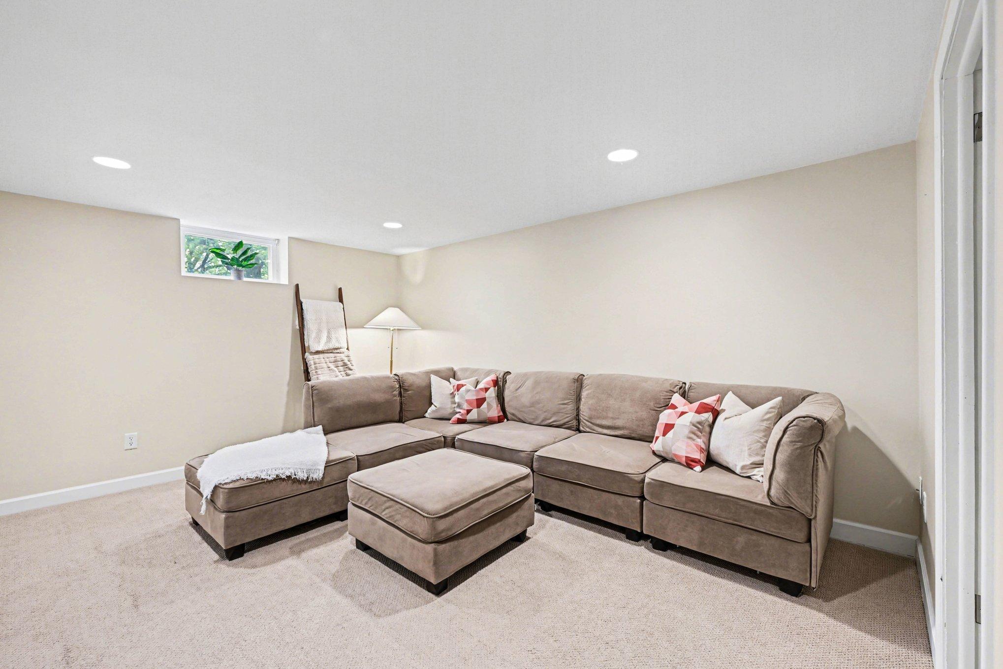 Large lower level living room provides additional lounging space!