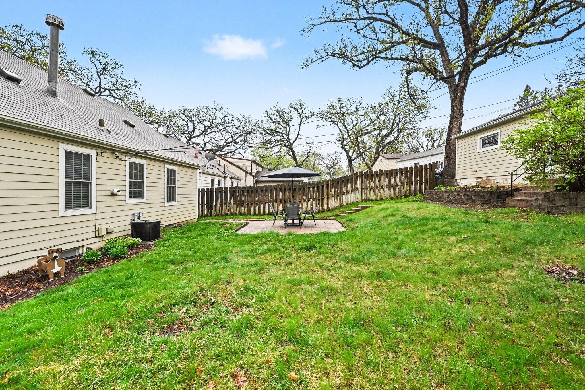 Huge corner lot. Fully fenced in and featuring an incredible patio!