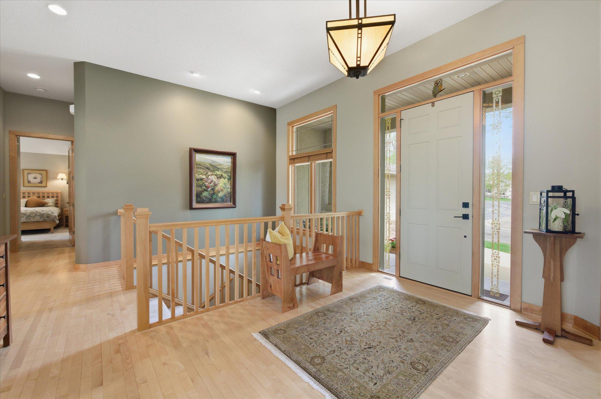 Spacious foyer with beautiful hardwood flooring