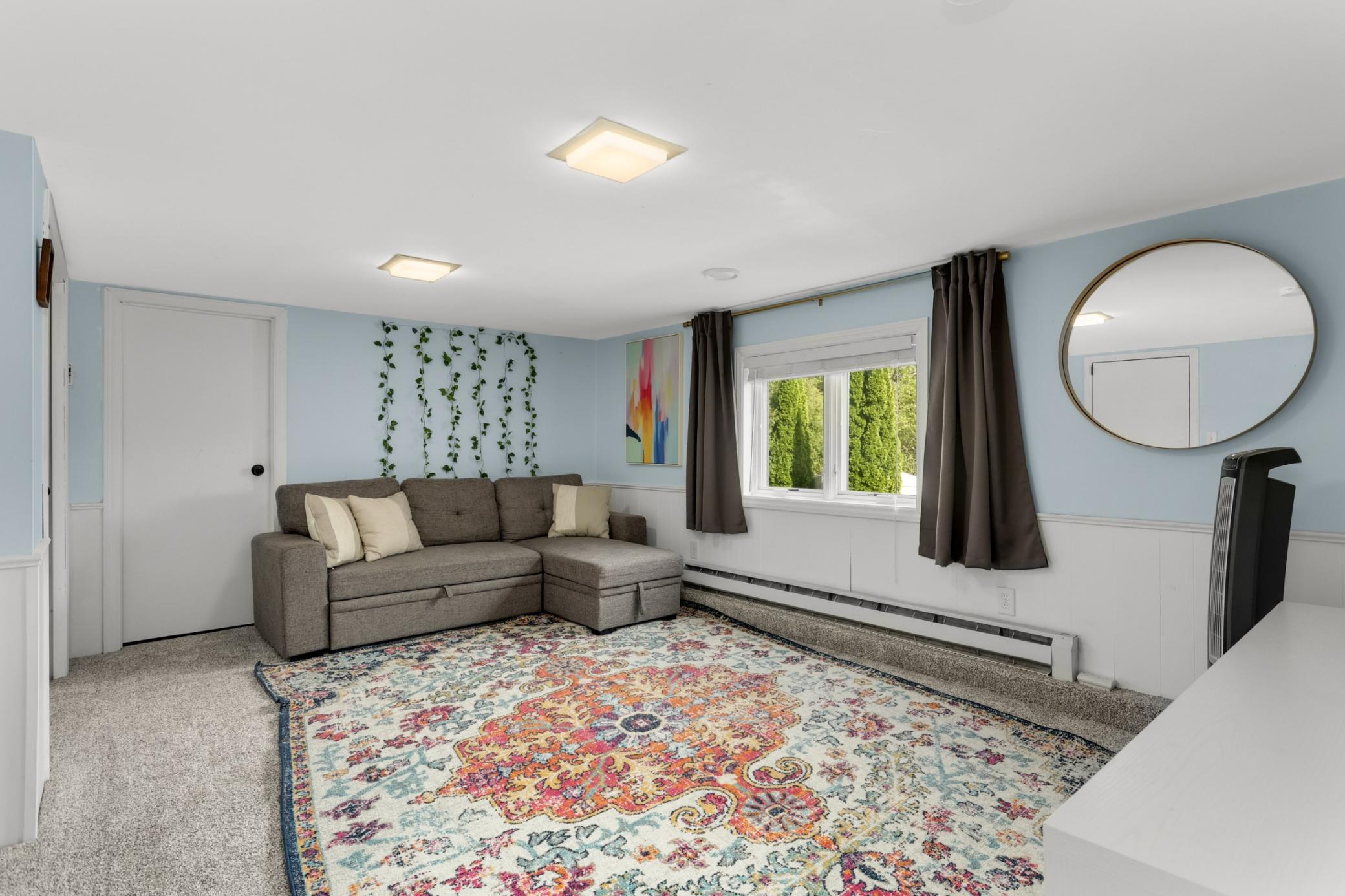 Lower level Flex Room - ideal as a movie/game room, kids hangout or non-confirming bedroom