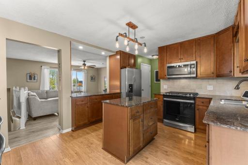 Beautifully updated kitchen. Newer stainless steel appliances, gas range, pantry storage, and island.