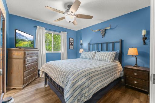 Primary walk-through ensuite bathroom with generous closet storage.
