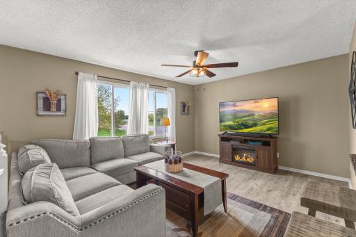 Spacious living room with tons of natural lighting.