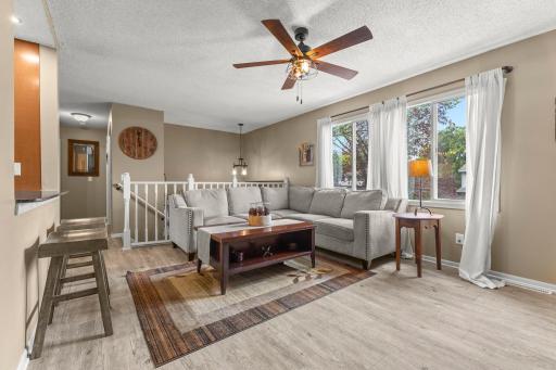 Spacious living room with tons of natural lighting.