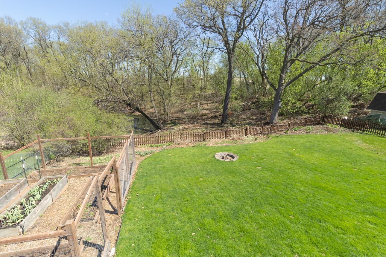 Backyard with raised bed gardens.